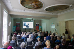 A full audience inside Bath Royal Literary and Scientific Institution