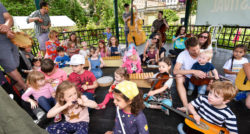 Children at Family Arts Day playing with musical instruments