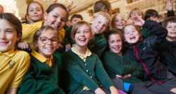 School children smiling for the camera