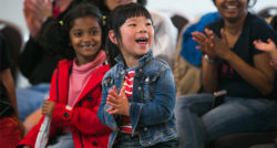 Children clapping and smiling