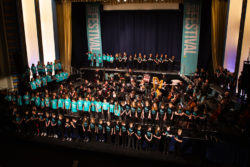 Schools' Voices choir onstage at the Forum with Bath Philharmonia Orchestra