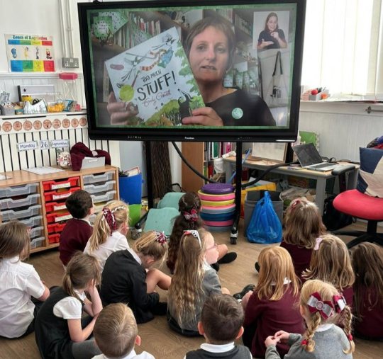 Emily Gravett on a TV screen being watched by school children